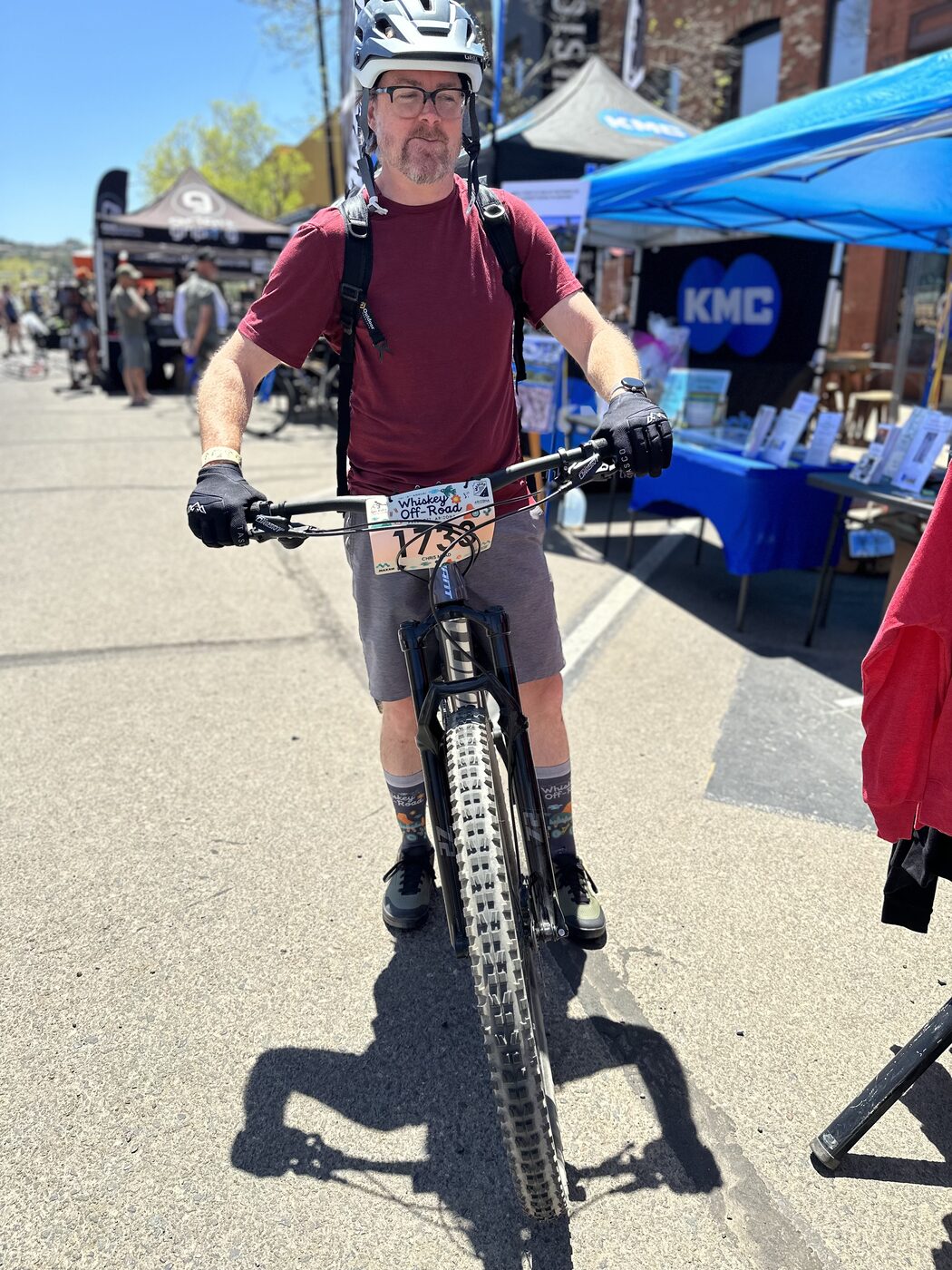 Chris standing with his mountain bike at the Whiskey Off-Road